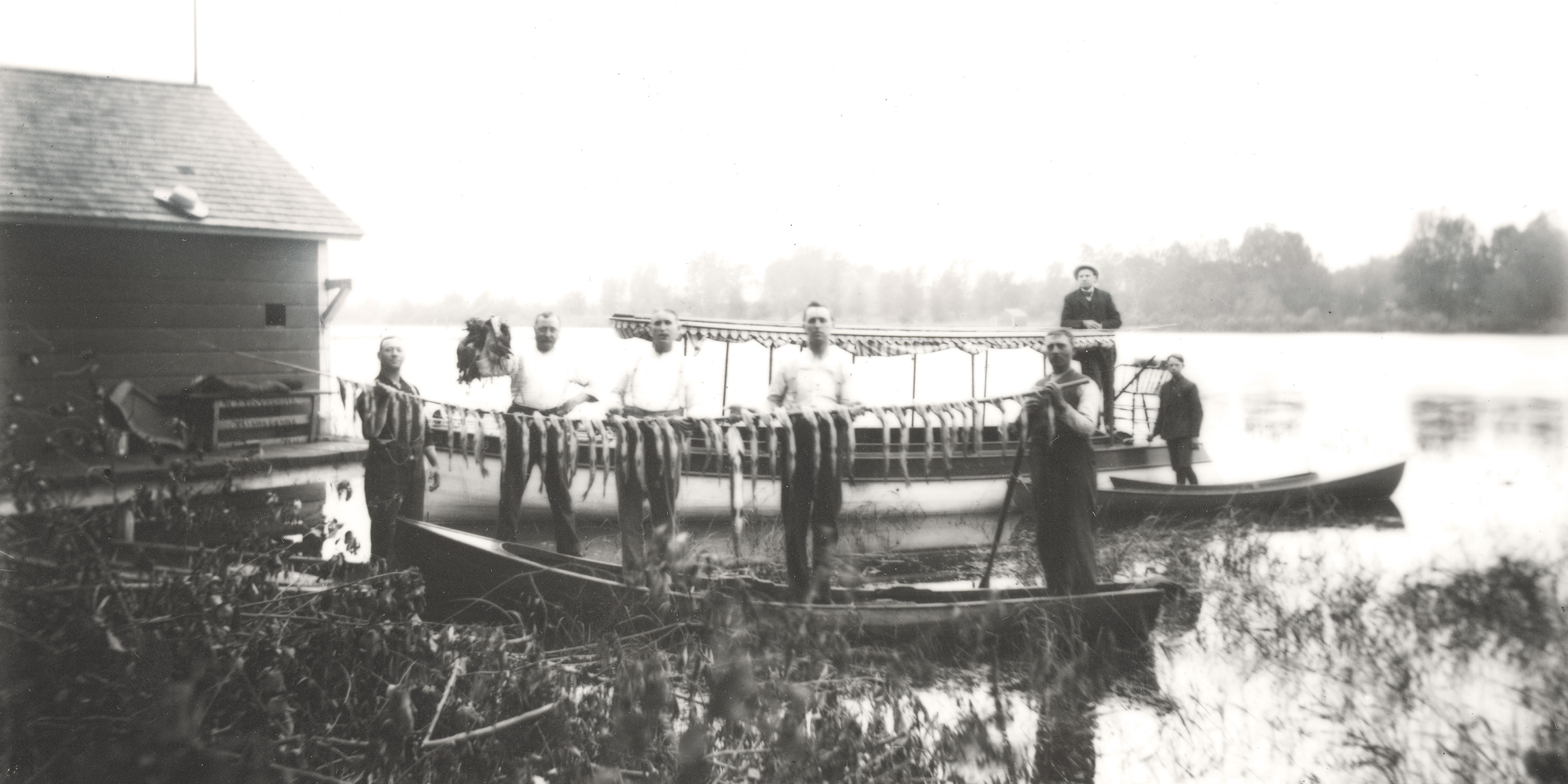 Historic black and white photograph of fishermen