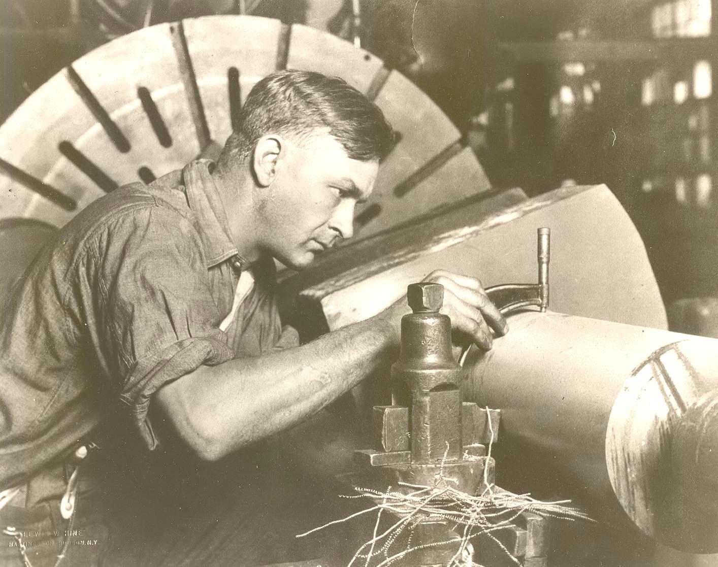 Photograph entitled Man with Micrometer by Lewis Hine, circa 1921