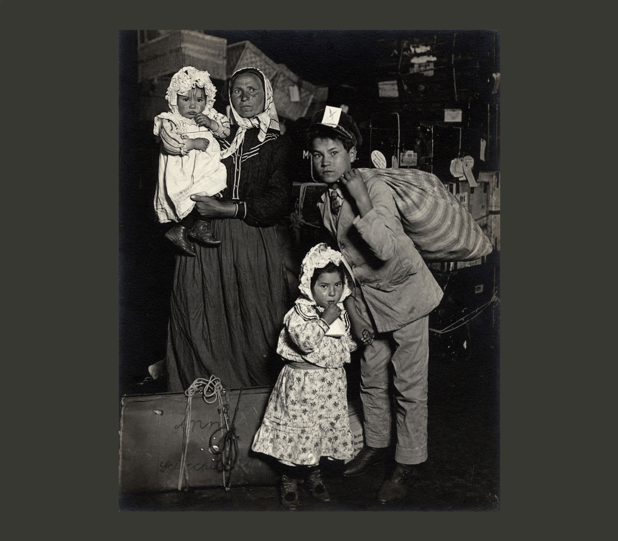 Historic photograph by Lewis Hine titled "Italian Family Seeking Lost Luggage"
